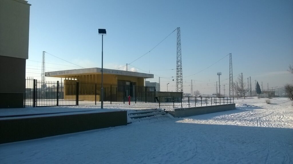 Entrance to the ghetto, modern industrial buildings under the snow.